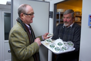 David Nowell inspects the goats cheese Tom Wallis of Lowna Dairy 